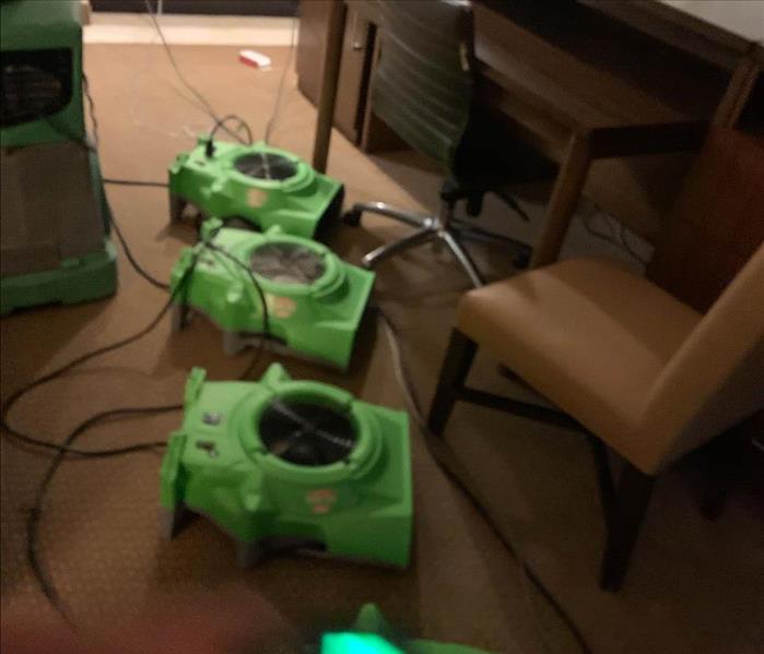 Air movers in hotel hallway.