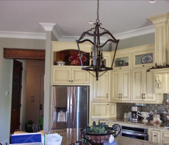 Kitchen area with smoke damage.