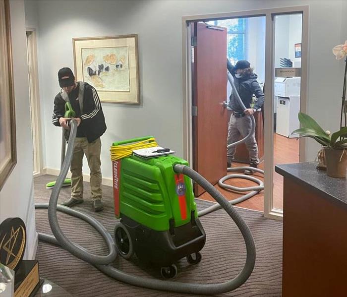 SERVPRO employees extracting water