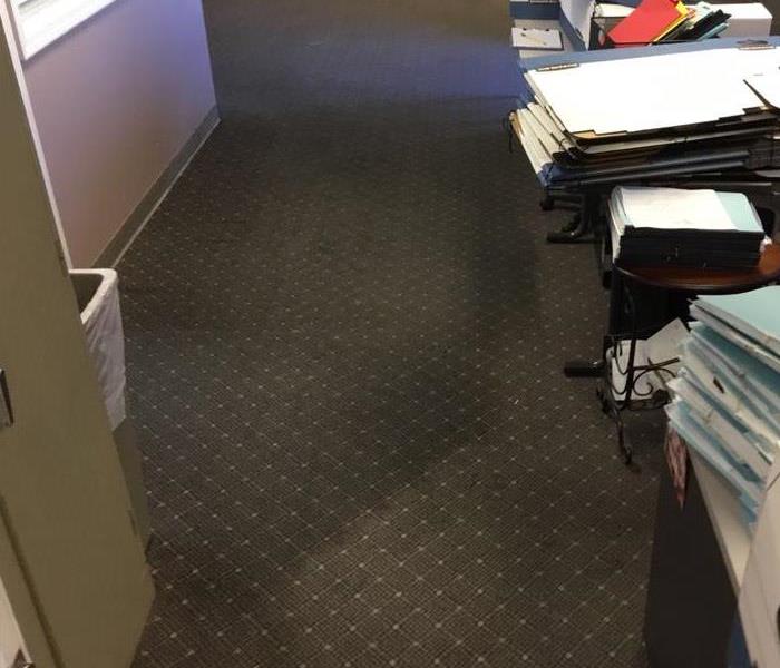 Wet carpet in office area.