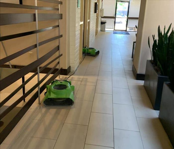 Air movers running in a hallway.