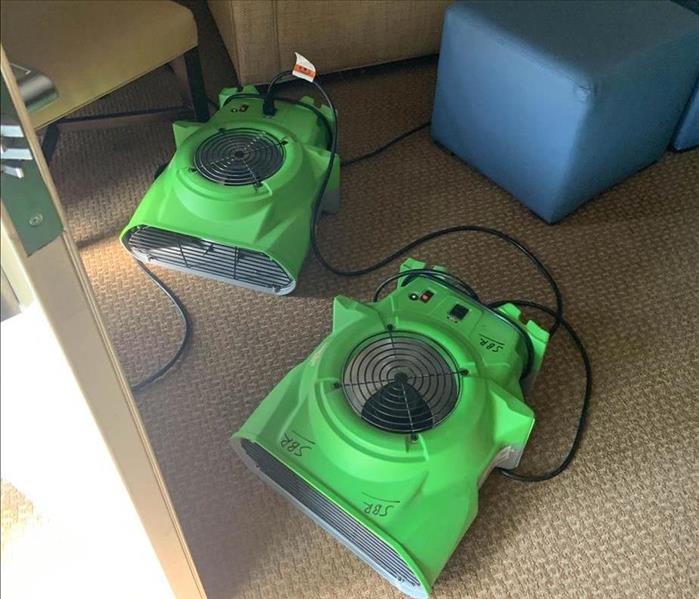 Air movers on carpet floor.