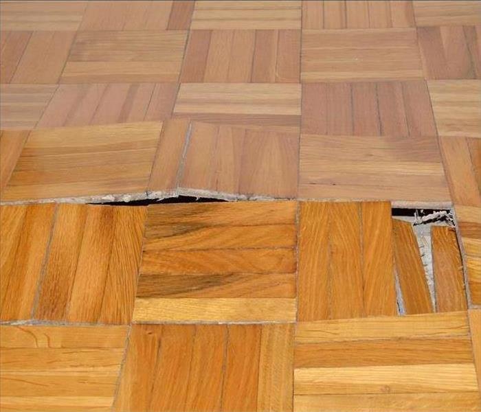 wooden floor damaged by water